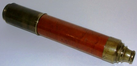 19th century hand-held refracting telescope made by Dolland London, ”Day or Night”. With two brass draws and a mahogany and brass bound tube. 