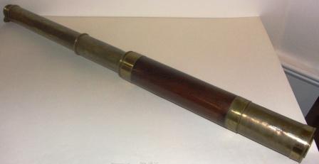 19th century hand-held refracting telescope, maker unknown. With two brass draws and a mahogany and brass bound tube. 