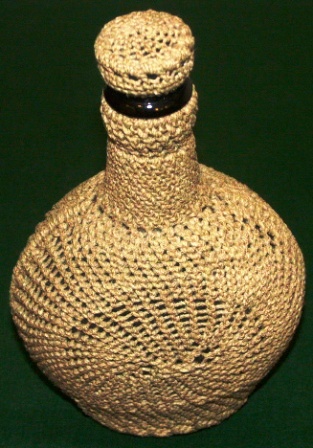 Rope-coated glass bottle with decorative pattern